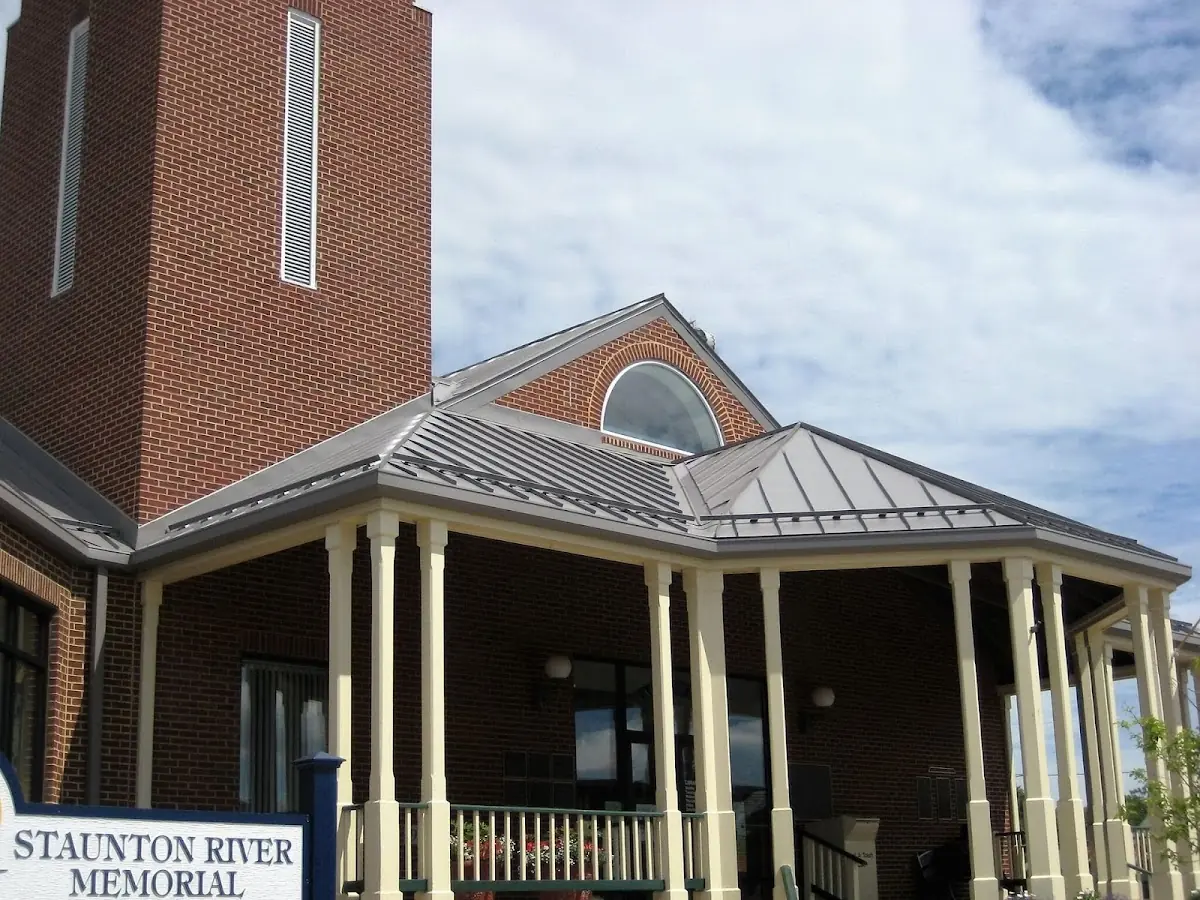 Skilled roofing craftsmen working on a residential roof in Woodstock